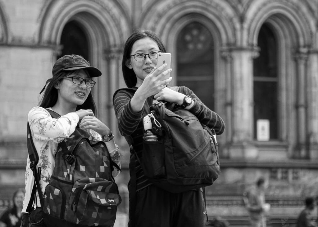 Black and Whit Photo taken on a Welshot Photographic Academy Event - Learn Your Camera in 24 Shots or Less - Two Tourists standing outside the Manchester Town Hall