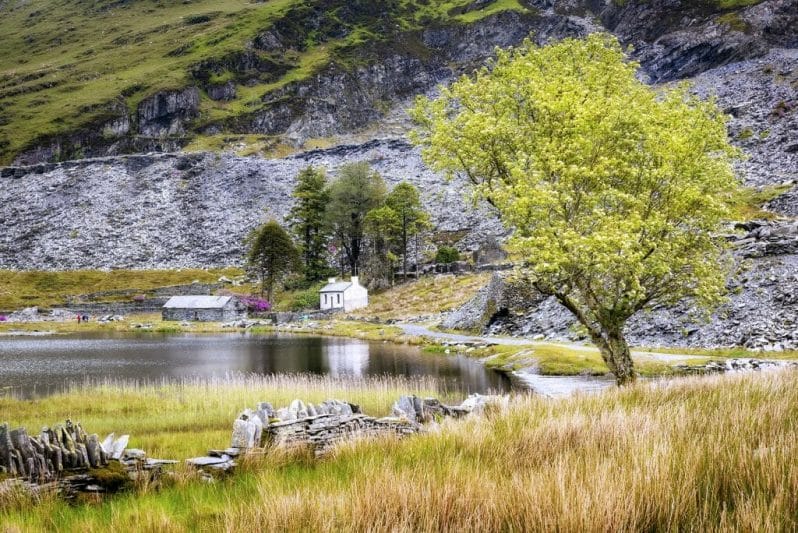 Walking with Your Camera Photographic Workshop from Welshot and Team Leader Helen Iles - Photo is a White House, Trees and Welsh Slate Quarry reflected into the Lake at Cwmorthin in the snowdonia National Park