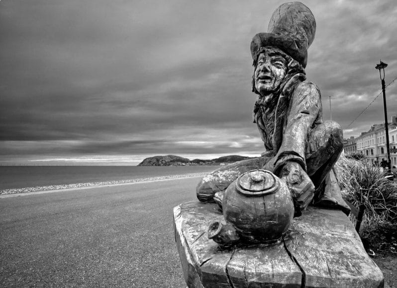 Black & White Photo of Mad Hatter Statue on the Llandudno Prom in North Wales. Taken on a Welshot Imaging Photographic Academy Event by Victoria smith