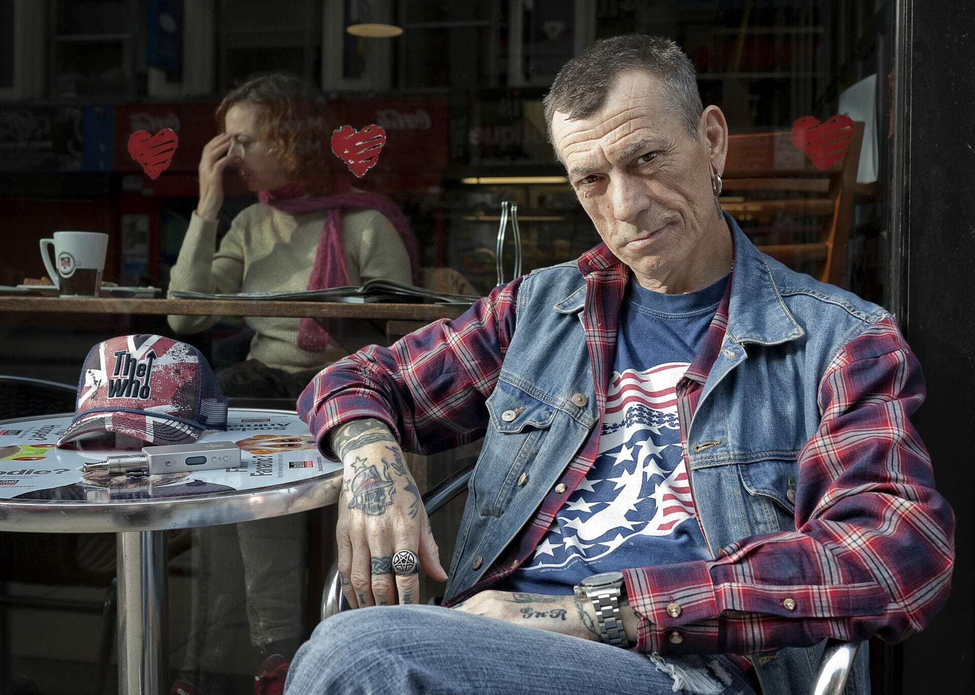 Coloured Photo of a Man sitting outside a cafe
