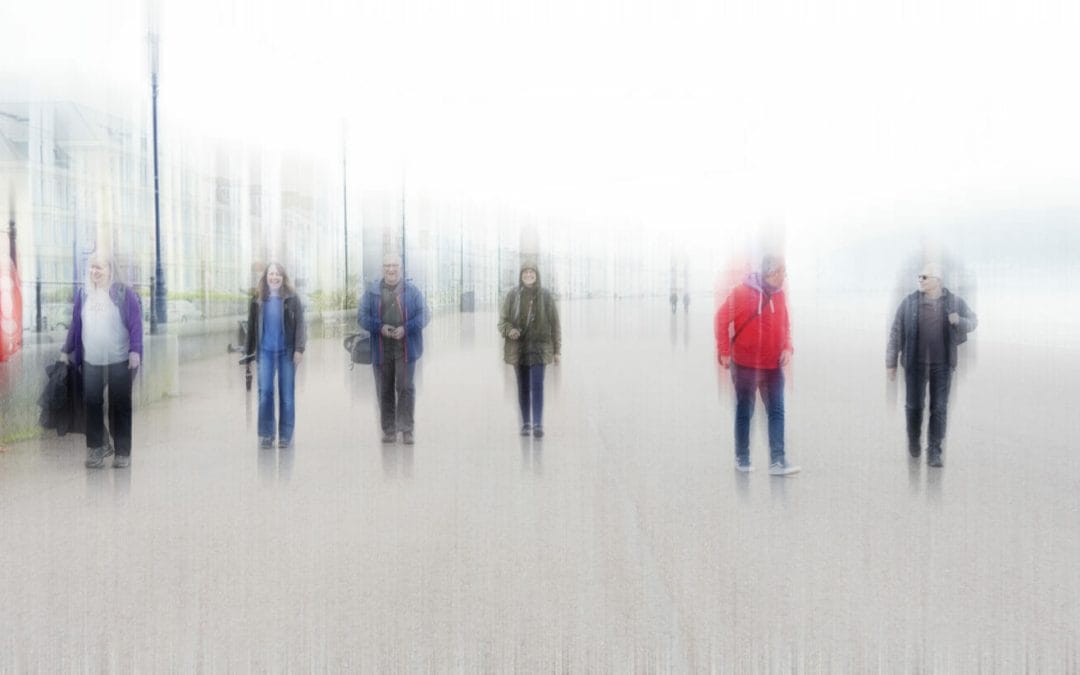 A blurred image (intentional camera movement) of a group of people socially distancing walking along the Llandudno Prom in North Wales. Taken on a Welshot Photographic Workshops and Events Day