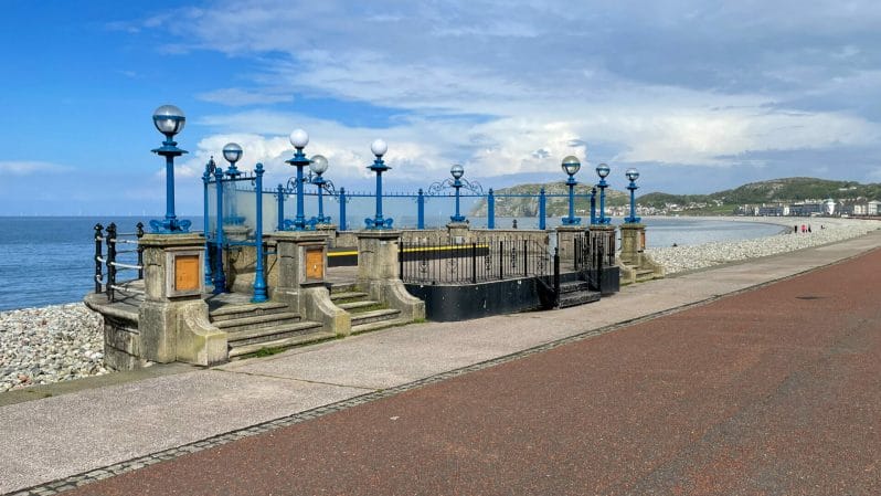 Photo of the bandstand on Llandudno prom in North Wales with blue sky and white clouds