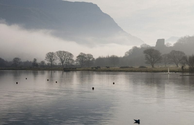 Dolbadarn Castle and Lake Padarn in the mist in Llanberis North Wales