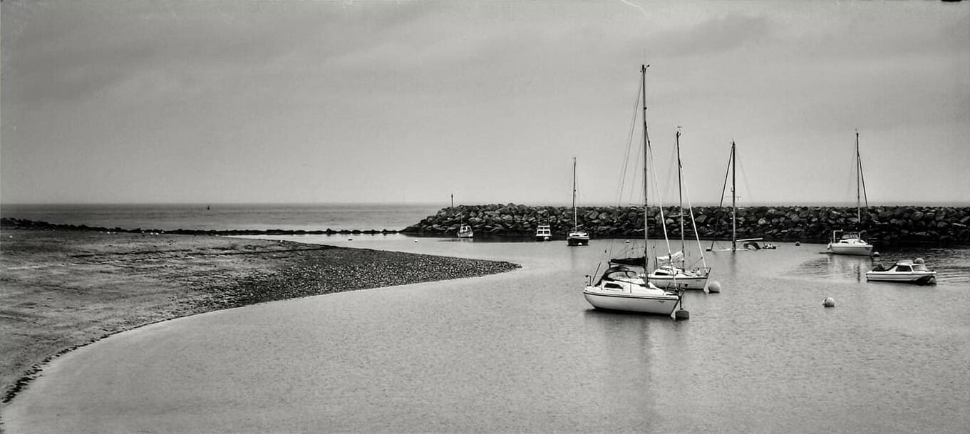 Black and White Photo of sail boats in the Rhos on Sea harbour in North Wales