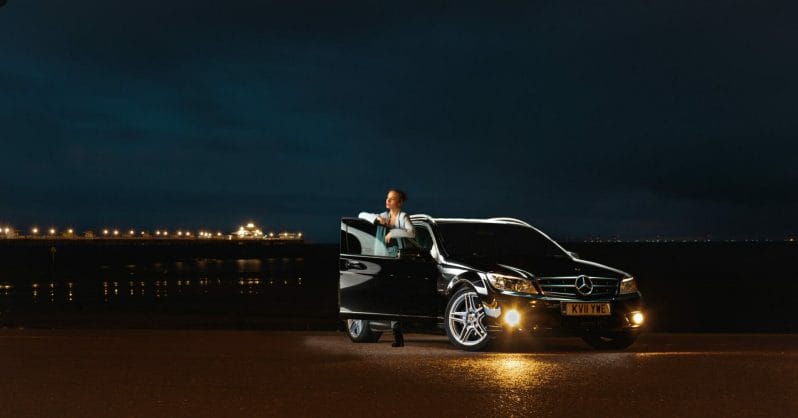 Car Photography on Location - Photo of Car on the Llandudno Prom in North Wales with a Model - Lit by a single light - Taken on a Welshot Photographic Academy Car photography workshop