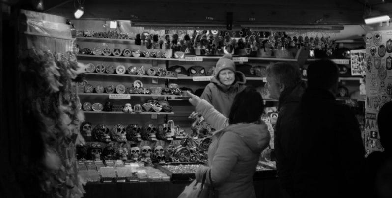 Black and white photo of person shopping at the Chester Christmas Markets