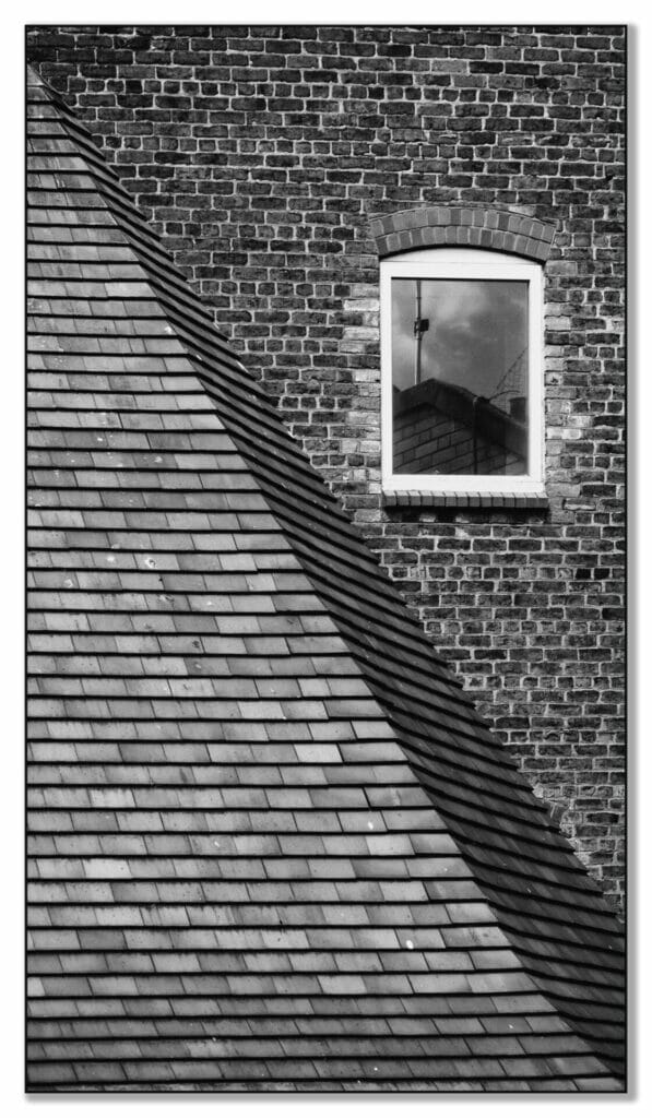 Black and White Photo showing architectural details from along the Chester City Walls.  