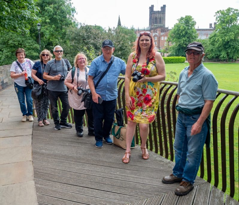 A group of people on the Chester City Walls who are attending a Welshot Photographic Mini Module