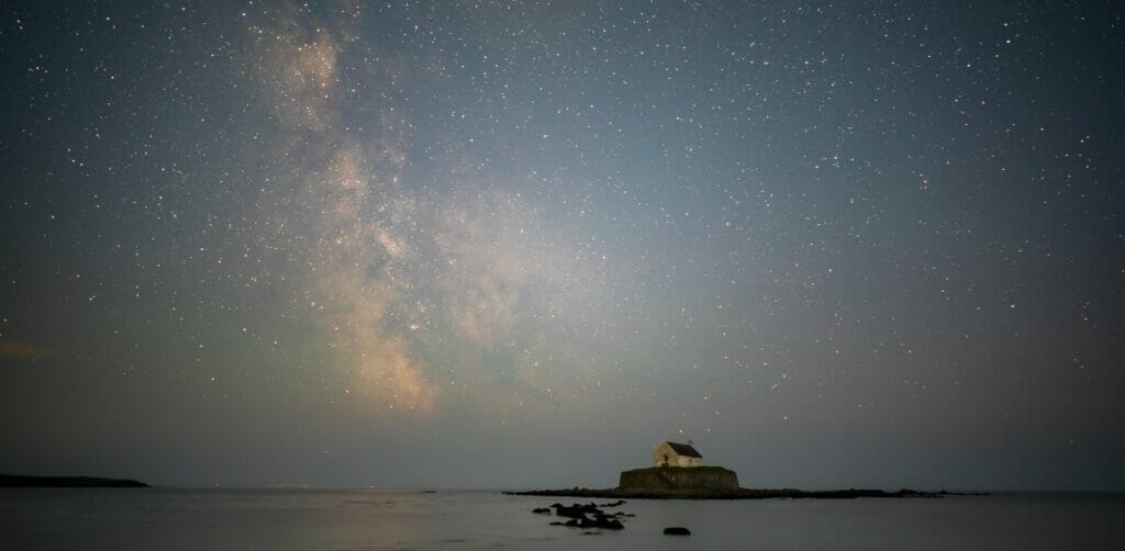 Photo of the Church in the Sea on Anglesey with the Night Sky and Milky Way