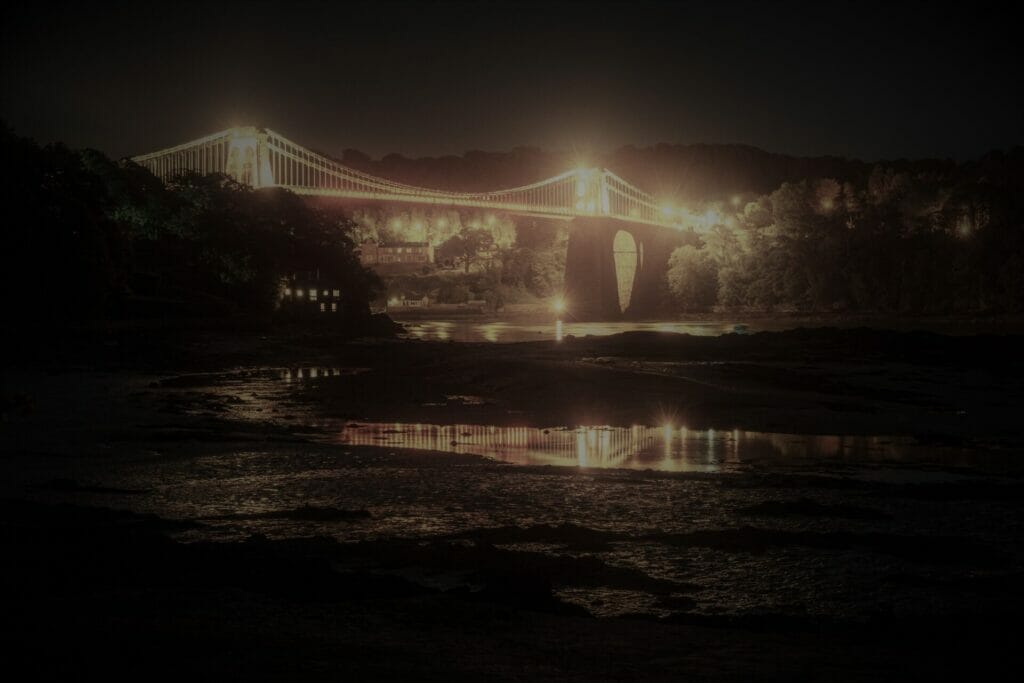 Photograph of the Menai Bridge on Anglesey lit up at Night