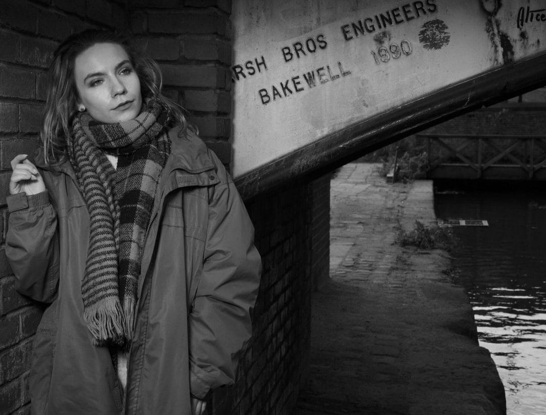 Off Camera Flash Photography- Castlefields Manchester - Black and White Photo of a Model posing in Winter clothing