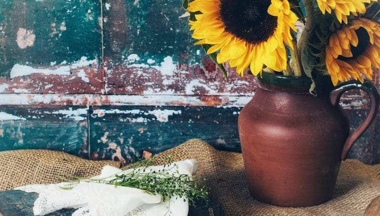 Still-Life & Floral Photography - Welshot Creative Hub - Photo of Sunflowers in a brown jug in front of a distressed background