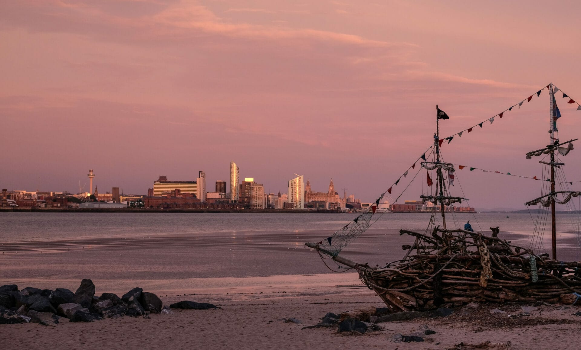 Lighthouses, Skylines, Photography and Fish n Chips - Photo of a play ship on the shores of New Brighton over looking the Liverpool Skyline