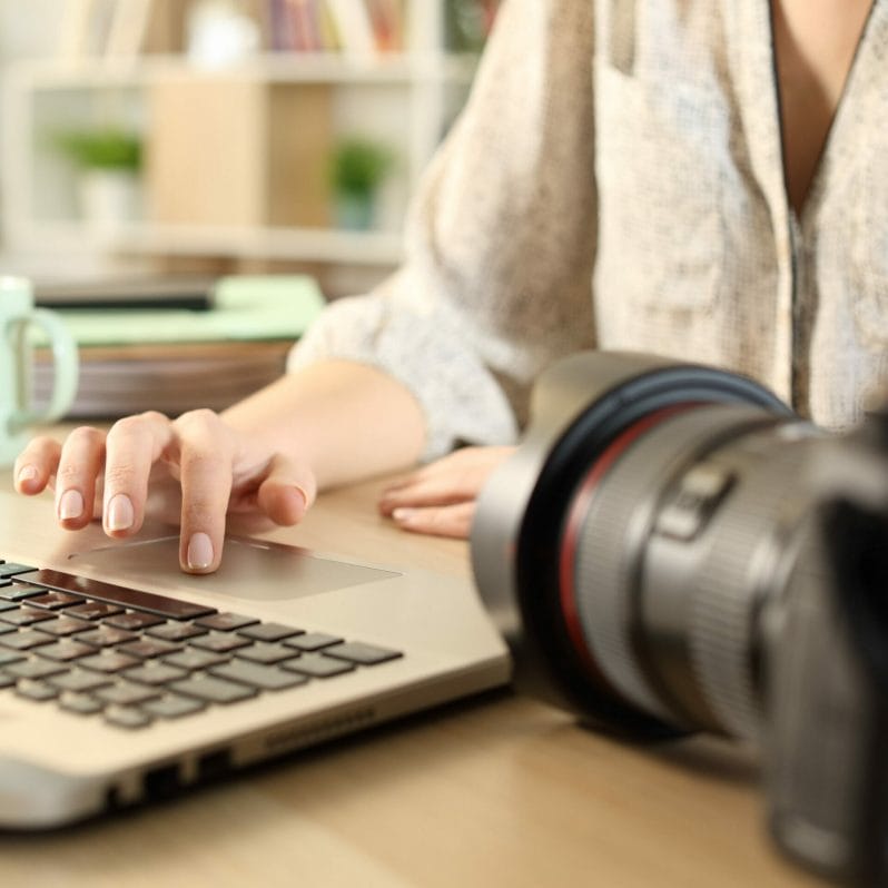 Photo of a Woman and a keyboard with a camera in the foreground - advertising the Welshot Photographic Academy Post Processing & Editing for Photography workshop