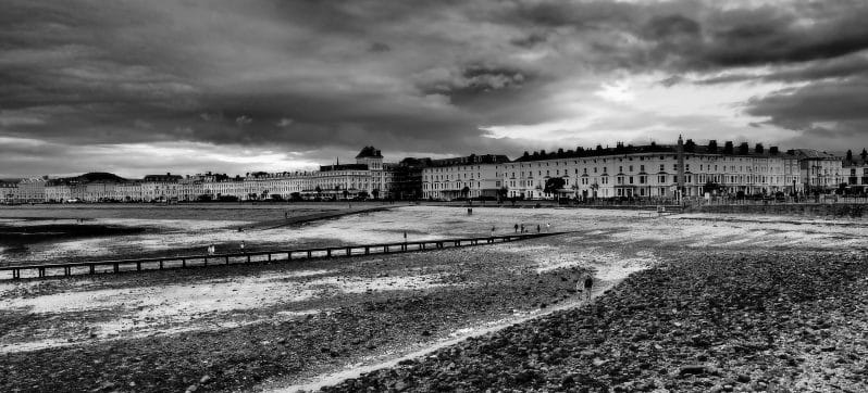 Seascapes & Sunsets in Llandudno  - Black and White photo of the North Shore Beach in Llandudno at low tide with the Victorian Hotels and Houses in the distance