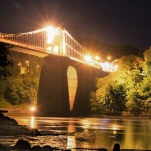 Anglesey Bridges at Night - Low-Light Photography - A square photograph of the Menai Bridge taken at night time